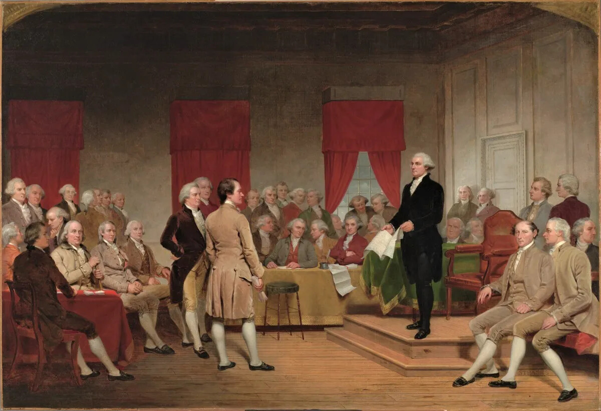A colored painting of a room full of seated and standing white men in different colored long coats, vests, knee-length pants, long stockings, and buckled shoes. All of the men look at the man standing on a raised platform, who is dressed in all black and holds an opened document in his hands.