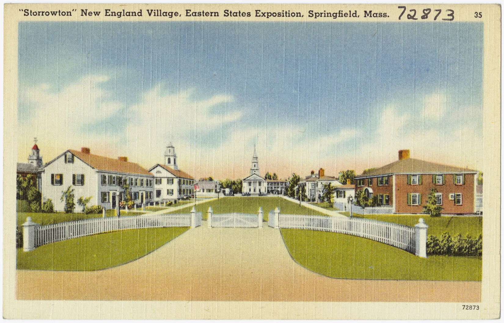 A colored postcard of a group of multi-storied houses and churches facing each other across a green field. At the forefront of the postcard is a curved white picket fence. The title of the postcard, located along the upper border, reads "'Storrowton' New England Village, Eastern States Exposition, Springfield , Mass. 72873 35."