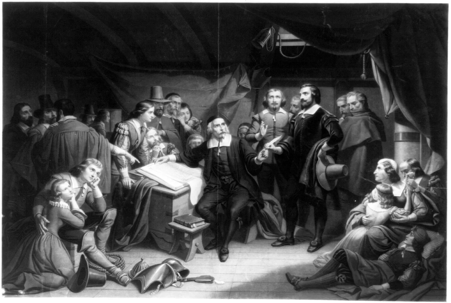A black and white painting of a group of men, women, and children standing and sitting in a crowded room. Everyone is looking at a man wearing a long coat with a wide collar, knee-length pants, long stockings, and buckled shoes, who sits in front of a small table. The man points to an opened book on the table.