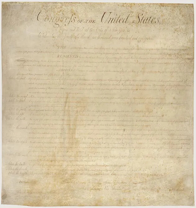A faded vertical document on browning paper, handwritten in cursive handwriting in black ink. The document's title, located along the upper border, reads "Congress OF THE United States. Several paragraphs of text are seen beneath the title.