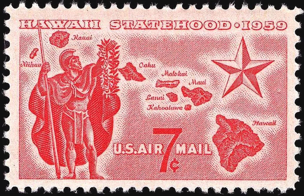 A closeup of a white stamp with red print shows a man with a spear, helmet, and cape on the left. He holds up a garland to the right. On the right is a large, five-pointed star. In the middle are islands, arranged in an arc from bottom right to upper left. They are labeled, the biggest one named "Hawaii." The stamp reads "HAWAII STATEHOOD 1959 U.S.AIR MAIL 7¢.". 